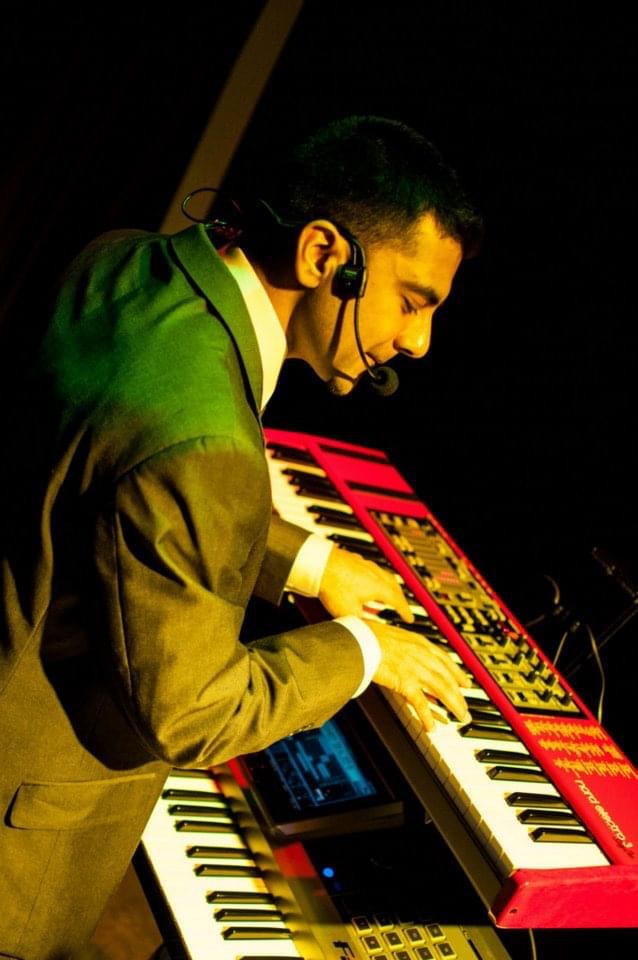 Ken performing live at a corporate event in Hamilton